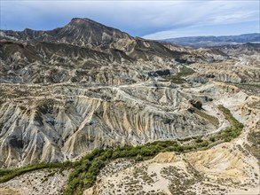 Barren mountain slopes and valleys with rugged, dry landscape, aerial view, Tabernas Desert,