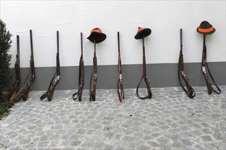 Hunting rifles, so-called shotguns, leaning against a house wall, Lower Austria, Austria, Europe