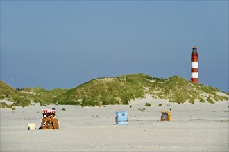 Lighthouse and beach chairs, Amrum, North Frisian Islands, Schleswig-Holstein, Germany, Europe