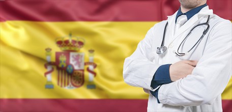 Male doctor with stethoscope on Spanish flag isolated. Spanish Health and Care concept. Doctor with