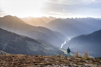 Hiker on the Venet, Upper Inn Valley in the morning light, view from Venet, Ötztal Alps, Tyrol,