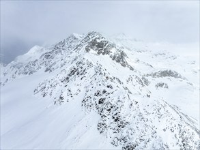 Aerial view, Snowy mountain landscape in fog, Ortler group, Trento, Italy, Europe