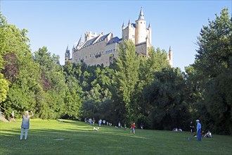 People in the park at the Alcázar of Segovia, Segovia Castle, medieval castle, city of Segovia,