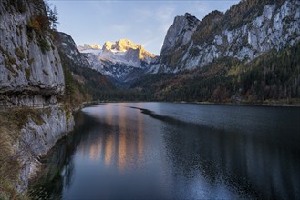 The Vordere Gosausee lake in autumn with a view of the Dachstein mountain range. The Gosaukamm on