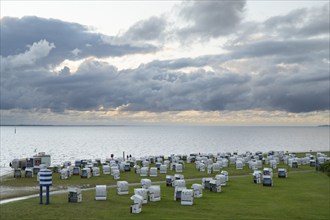 Beach chairs on the green beach, Dramatic sky over the North Sea, View from above, Norddeich, East