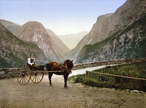 A woman in a horse-drawn carriage on Stalheimskleven (Stalheimskleiva), the road to Stalheim,