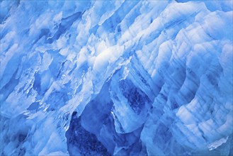 Blue ice patterns on a glacier wall in the arctic, Svalbard, Norway, Europe