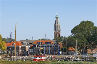 Small harbour and town view of Enkhuizen with tower of the Zuiderkerk church, Enkhuizen, North