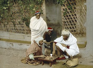 Blacks playing chess, Algiers, Algeria, ca 1890, Historical, digitally restored reproduction from a