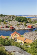 View of summer house by a rocky coast in the archipelago on the Swedish west coast on a sunny