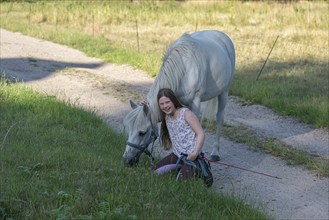 Girl, 10 years old with her horse, Othenstorf, Mecklenburg-Vorpommern, Germany, Europe