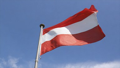 Flag, the national flag of Austria fluttering in the wind