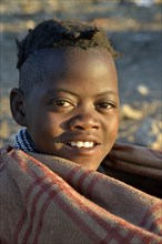 Young shepherdess from the Himba people, Ombombo, Kaokoland, Kunene, Namibia, Africa