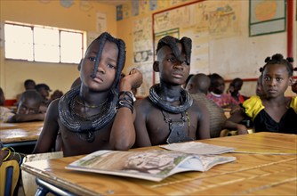 Girls, Himba pupils, sitting in a classroom at the Omohanga Primary School, Himba school, Omohanga,