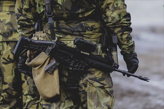 A soldier with a rifle, taken during the military exercise 'Wettiner Schwert' with German and Czech