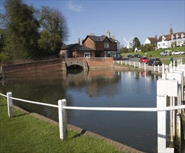 Pond and historic buildings in the attractive tourist honeypot village of Finchingfield, Essex,