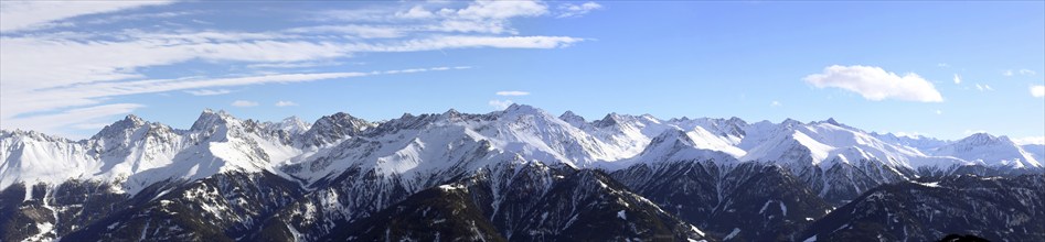 Alpine panorama with snow-covered mountain peaks in winter. Taken in the ski resort of Serfaus Fiss