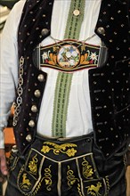 Man in traditional traditional costume, lederhosen and braces with colourful embroidery, Bavarian