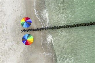 People with colorful umbrella at a groyne, beach of Baltic sea, aerial view, Mecklenburg-Western