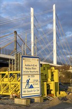 Construction material storage at the A40 Neuenkamp bridge, pillars and stay cables of the new