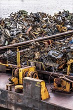 Push barge, loaded with scrap metal, for recycling, melting down, in the harbour canal,