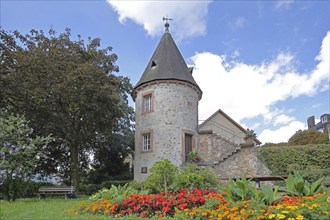 Historic stag tower built in 1330, town tower, empty bench, flower bed, Zell am Harmersbach,