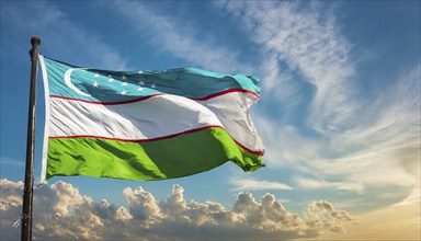 Flags, the national flag of Uzbekistan flutters in the wind