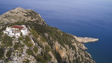 Drone shot, A hill with a building and a fantastic view of the sea and the coast, Panagia Kyra