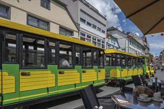 Tourist train runs through the town centre of Bad Kissingen, Lower Franconia, Bavaria, Germany,