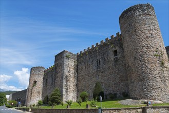 Massive medieval castle wall with stone towers under a clear blue sky, Castle, Castillo de la