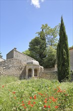 Pavillon de la Reine Jeanne built in 1581, cypress, mountain village, Les Baux-de-Provence,