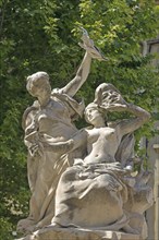 Fountain with sculptures, two woman, mask, high, hold, arm, up, robe, theatre square, Orange,