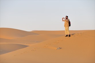 Man (50-55), desert trekking, Erg Chebbi, Morocco, Africa