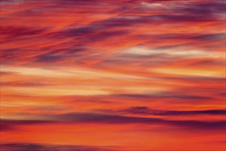 Orange-red coloured cloudy sky after sunset, cloud formation, evening sky, sunset,