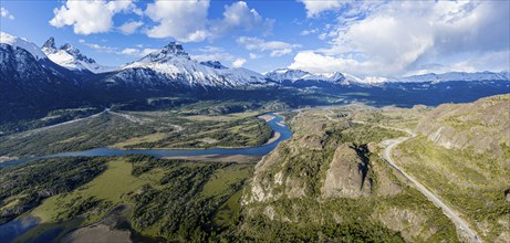 Confluence of river Estero Parada flowing into Rio Ibanez, aerial view, snow-capped mountains in