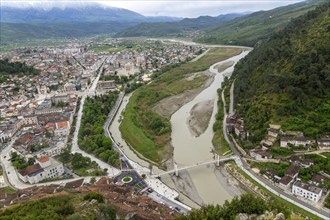 View looking over city centre of Berat in valley of River Osum with mountains beyond, Berat,