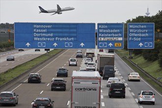 Aircraft from the airport located directly next to the motorway above the traffic on the A5