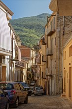 Narrow cobbled street in the historic centre of the Sicilian town of Castelbuono. Sicily, Italy,