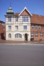 Listed residential building with imitation half-timbering, Welscher bonnet and triangular gable