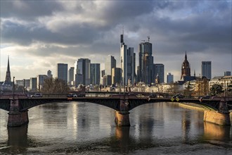 Skyline of the city centre of Frankfurt am Main, river Main, Ignatz-Bubis-Bridge, dusk, Hesse,