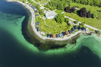 Aerial view of beach and church in Selje, wooden boat sheds, Stad, Vestland, Norway, Europe