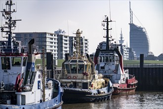 Harbour tugs, tugboats, towboats, at the tugboat pier, Atlantic Sail City Hotel, in the seaport of