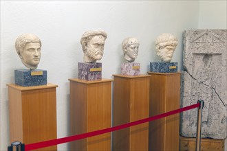 Carved marble Roman portraits head of four men, archaeology museum, Apollonia Archaeological Park,