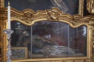 Magnificent glass shrine with decorated bones of a catacomb saint, Basilica of St Mauritius,