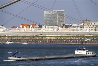 Cargo ships on the Rhine near Düsseldorf, bridge over the Media Harbour, Oberkassler Rhine Bridge,