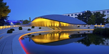 Illuminated Porsche Pavilion in the evening, Autostadt, Volkswagen AG, Wolfsburg, Lower Saxony,