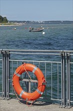 Lifebuoy, ferry pier, inflatable boat, people, Falckenstein, Kiel, Kiel Fjord, Schleswig-Holstein,