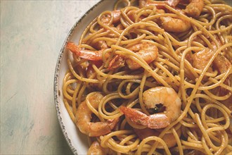 Spaghetti with king shrimps, with spices, top view, selective focus, homemade, no people