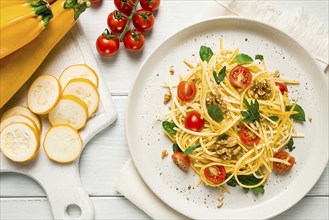 Yellow zucchini salad, with cherry, vegetarian food, sliced into strips, homemade