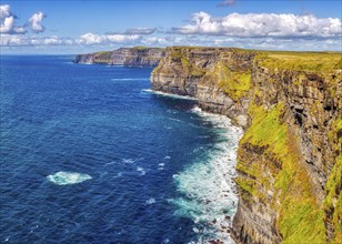 Dramatic cliff landscape with impressive coastline and deep blue water, Cliffs of Moher